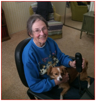 seated elderly lady with dog