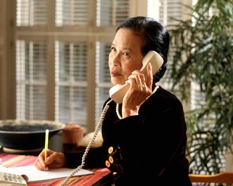 woman answering telephone