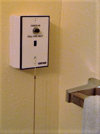 A CISCOR check-in button in a senior housing community